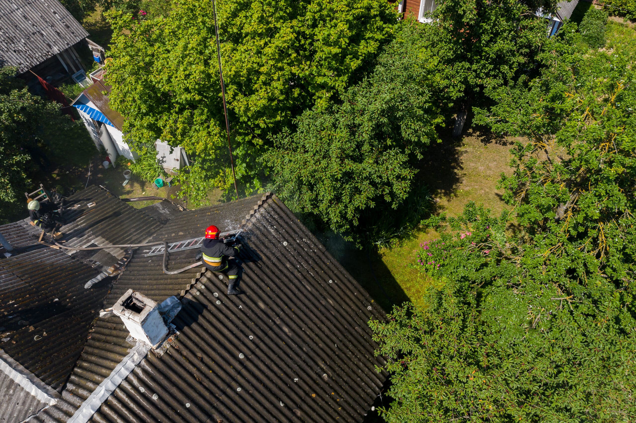 a-firefighter-sits-on-the-roof-of-a-burning-house-2026-01-11-09-31-29-utc