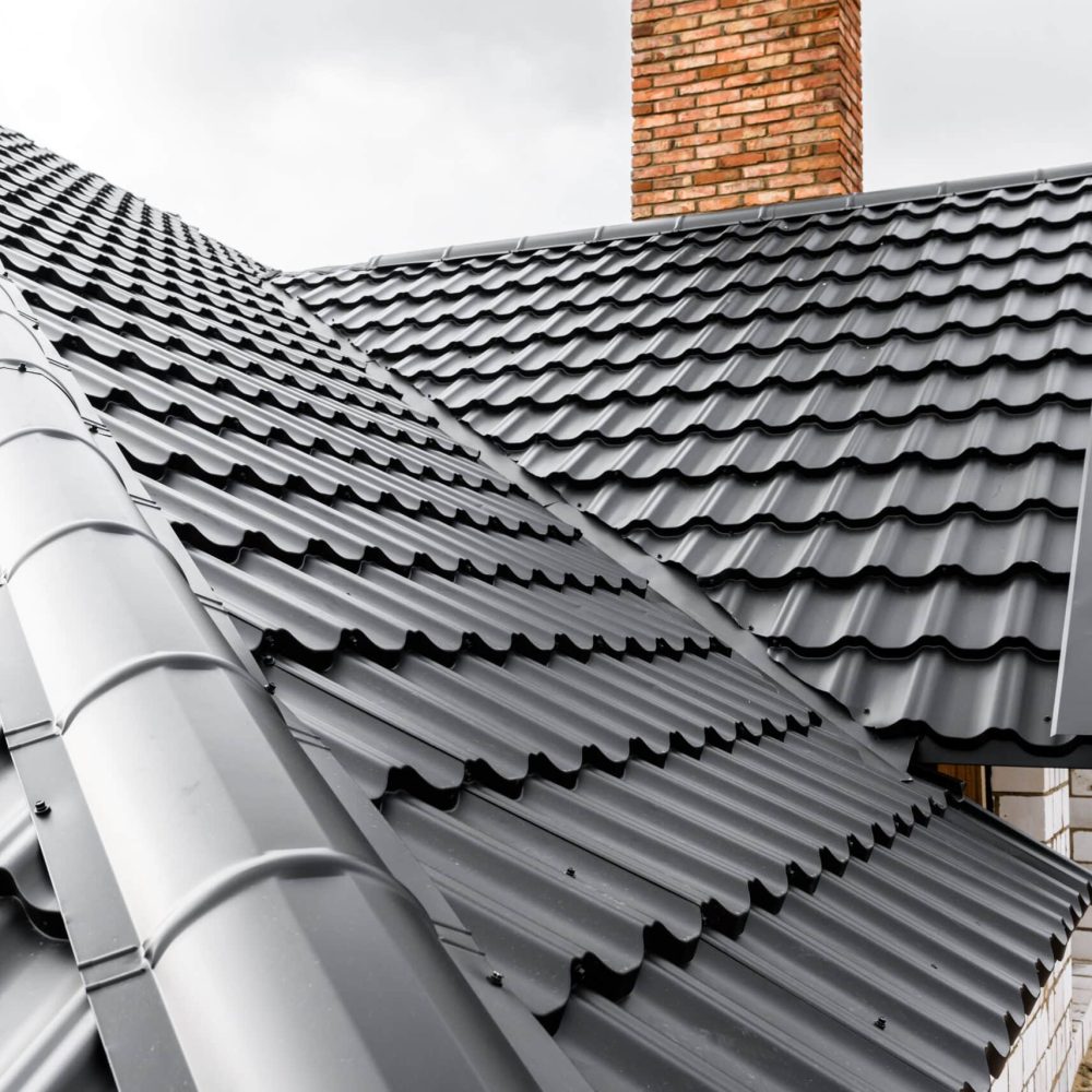 Construction of the roof of the house. Metal tiles.
